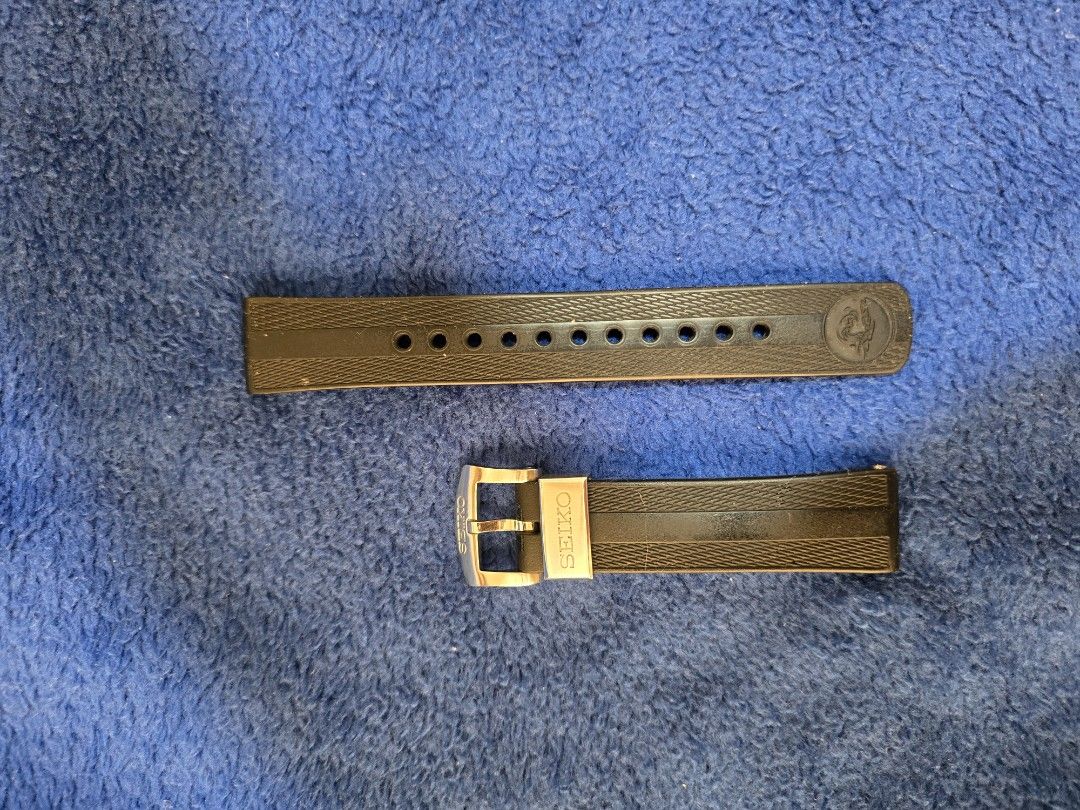 Seiko Rubber Watch Strap Black (Category: Men's Watches) located in Manila. Submitted by anton815 (Listing ID 1469451244, Image 1). Description: - Authentic Seiko black rubber watch strap from 62 mas - Textured pattern with ventilation holes for breathability - Durable and water-resistant material ideal for divers and sports watches - Stainless steel buckle with engraved Seiko branding - Includes keeper loop - Standard replacement band, easy to m