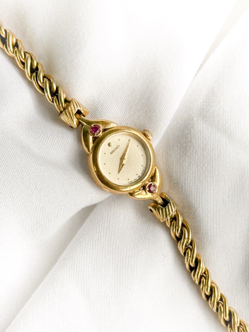 Seiko Ruby Vine Bracelet Watch (Category: Women's Watches) located in Santo Tomas. Submitted by elegante07 (Listing ID 1469482089, Image 2). Description: (RARE) Seiko 1E20 Ruby Vine Bracelet Watch Details: * Beautiful vine bracelet * Minimal fadings on strap (not noticeable, see pictures) * Part of 1E20 line * Excellent and in working condition ✨ * Model hard to come-by * Approx. 18 mm Case Diameter * Adjustable Strap! Fits wrist (approx. 16 cm) 