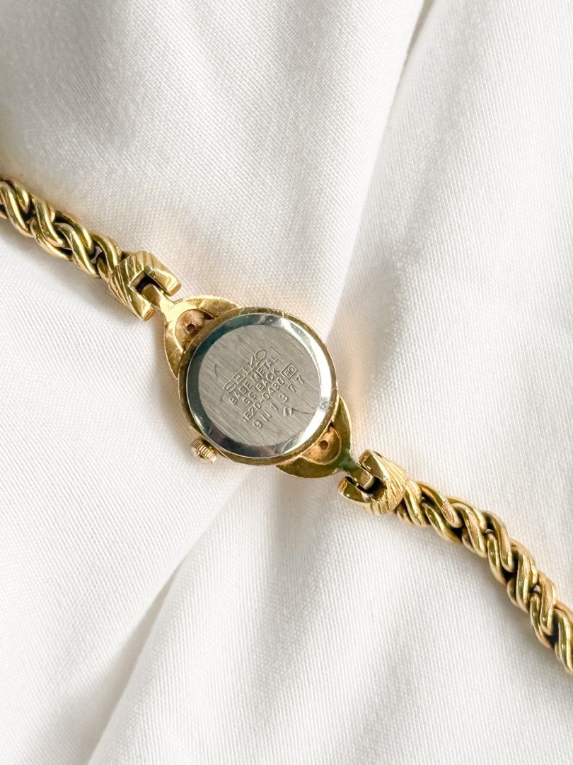 Seiko Ruby Vine Bracelet Watch (Category: Women's Watches) located in Santo Tomas. Submitted by elegante07 (Listing ID 1469482089, Image 3). Description: (RARE) Seiko 1E20 Ruby Vine Bracelet Watch Details: * Beautiful vine bracelet * Minimal fadings on strap (not noticeable, see pictures) * Part of 1E20 line * Excellent and in working condition ✨ * Model hard to come-by * Approx. 18 mm Case Diameter * Adjustable Strap! Fits wrist (approx. 16 cm) 