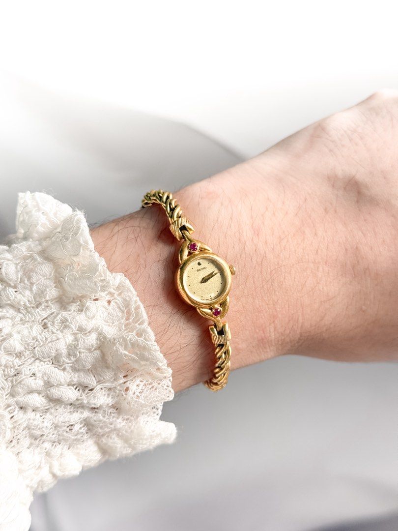 Seiko Ruby Vine Bracelet Watch (Category: Women's Watches) located in Santo Tomas. Submitted by elegante07 (Listing ID 1469482089, Image 1). Description: (RARE) Seiko 1E20 Ruby Vine Bracelet Watch Details: * Beautiful vine bracelet * Minimal fadings on strap (not noticeable, see pictures) * Part of 1E20 line * Excellent and in working condition ✨ * Model hard to come-by * Approx. 18 mm Case Diameter * Adjustable Strap! Fits wrist (approx. 16 cm) 