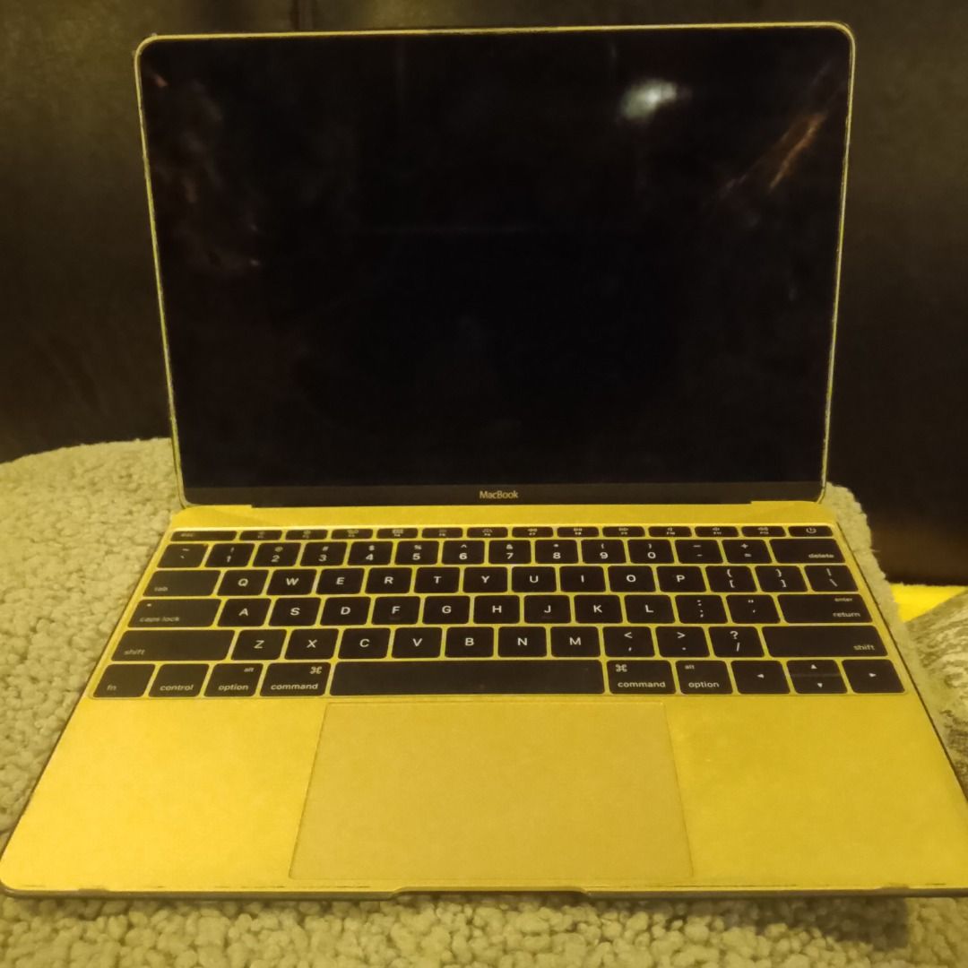 SELLING FOR PARTS (Category: Laptops & Notebooks) located in Roxas City. Submitted by demalatagiboy (Listing ID 1469485757, Image 2). Description: - Color: Stylish Gold - Condition: Powers on, fully functional for daily tasks, browsing, and typing; minor wear on edges near the keyboard from normal use - Design: Compact and easy to carry, iconic Apple logo on the lid - Keyboard & Trackpad: QWERTY layout with black keys and smooth trackpad below - 