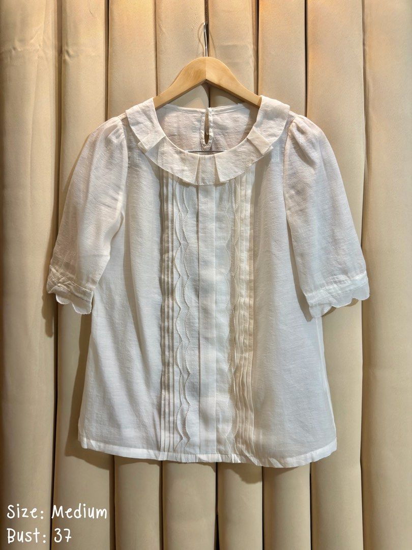SHEER PETER PAN COLLAR BLOUSE (Category: Blouses) located in Manila. Submitted by glamstylemnl (Listing ID 1469467601, Image 1). Description: ♡ SIZE: Medium ♡ BUST: 37 ♡ Swipe left to see the actual color & details ♡ vertical pintuck pleating down the front center, wavy ribbon lafe trim accents, scallopes edges along the elbow-length sleeves ♡ HQ • 10/10 ♡ Ready to wear 👚.