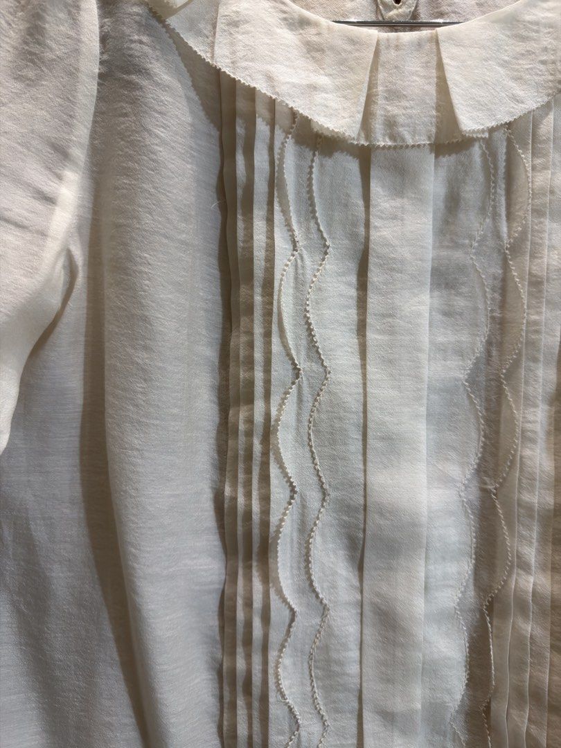SHEER PETER PAN COLLAR BLOUSE (Category: Blouses) located in Manila. Submitted by glamstylemnl (Listing ID 1469467601, Image 2). Description: ♡ SIZE: Medium ♡ BUST: 37 ♡ Swipe left to see the actual color & details ♡ vertical pintuck pleating down the front center, wavy ribbon lafe trim accents, scallopes edges along the elbow-length sleeves ♡ HQ • 10/10 ♡ Ready to wear 👚.