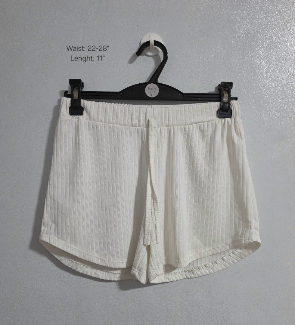 Shein Ribbed White Shorts Size XS (Category: Shorts) located in Paranaque City. Submitted by franinnashop (Listing ID 1469528007, Image 1). Description: declitter - Brand: Shein - Size: XS (EU 34, US 2) - Color: White - Material: Soft ribbed fabric - Waist: 22 to 28 inches (stretchy elastic waistband with drawstring) - Length: 11 inches - Features: Curved hem on the sides - Condition: Clean and well-maintained.