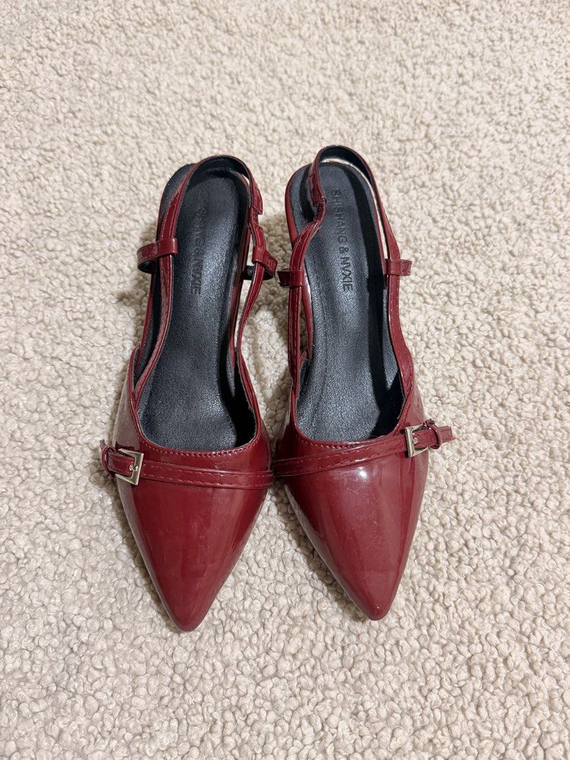 Shishang & Nixie Red Patent Slingback Heels (Category: Heels) located in Las Pinas. Submitted by ann.co. (Listing ID 1469543923, Image 1). Description: - Brand: Shishang & Nixie - Style: Red patent slingback heels with pointed toe - Details: Decorative front buckle and adjustable side strap - Heel: Comfortable low kitten heel - Interior: Black lining with branded insole - Condition: Brand new / Excellent (ready to ship!) .