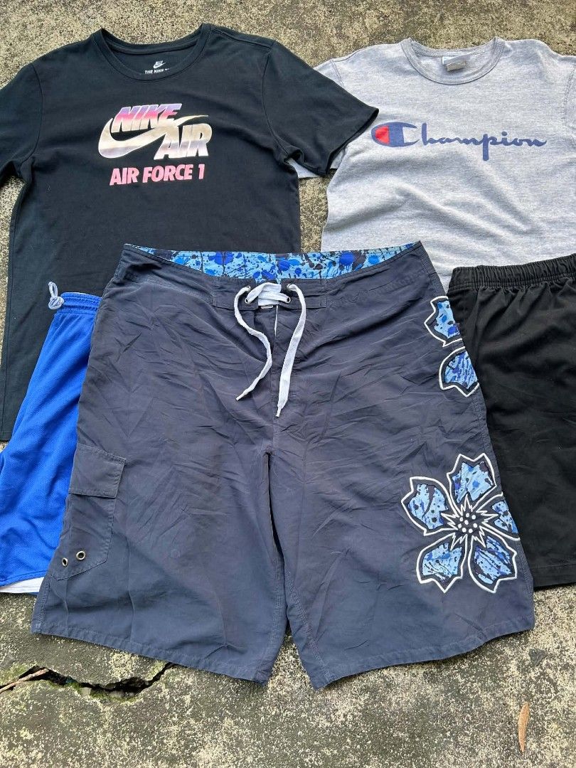 SHORT (Category: Shorts) located in Quezon City. Submitted by jaredalvarr (Listing ID 1469479783, Image 1). Description: - 4-piece bundle of casual tees and swim wear - Includes black Nike Air Force 1 graphic t-shirt - Includes grey Champion t-shirt - Includes dark blue floral board shorts with drawstring - Includes blue and black shorts - Good mix of styles, colors, and sizes - Sold as a set.