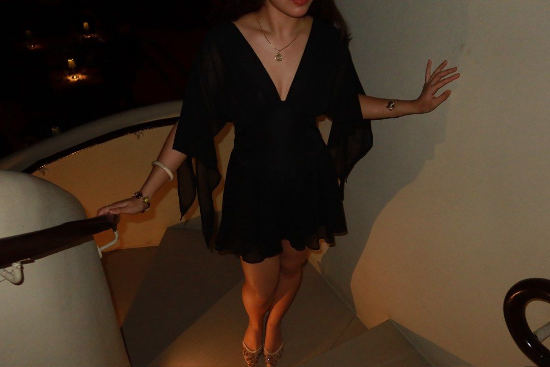 Short Black Dress with Flowy Sleeves (Category: Dresses) located in Pasig City. Submitted by shopsyre (Listing ID 1469501048, Image 2). Description: WORN ONCE ONLY, super flatteringg :) - Style: Siren Gaze black mini dress with deep V-neckline and gathered bodice - Sleeves: Sheer cape-style with stylish open slits down the arms - Fit: Fitted waist and flared pleated skirt, fits true to size - Material: Lightweight chiffon-like fabric.