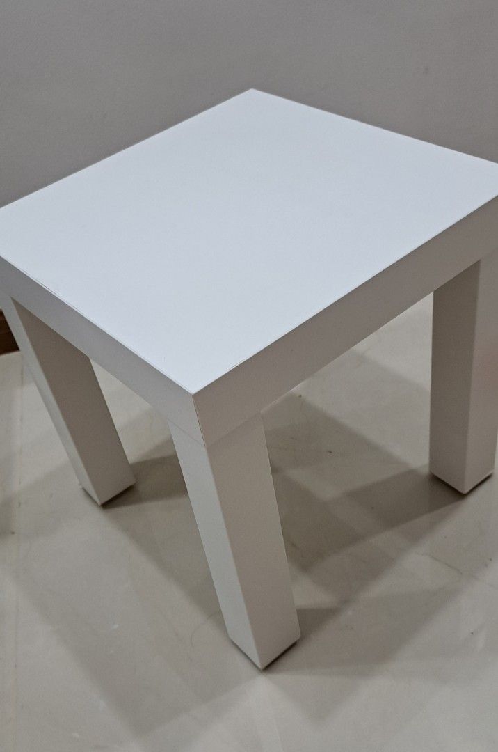 Side table (Category: Tables & Sets) located in Singapore. Submitted by jannielim9 (Listing ID 1469494020, Image 2). Description: - Type: Ikea Side / Bedside table - Colour: Clean white - Dimensions: L 35cm x B 35cm x H 35cm - Condition: 7/10 - Features: Lightweight, portable, and space-saving design.Good as a bedside table in a tight space. - Meetup location: Hougang Mall Car Park.