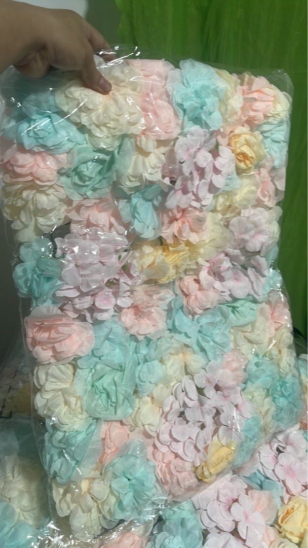 Silk Flower Wall Decoration Photo Prop Background (Category: Wall Decor) located in Imus. Submitted by rey15blue (Listing ID 1469559496, Image 2). Description: - Multi-colored artificial flower wall panels in dreamy pastel shades (blue, pink, yellow, cream) - Brand new and individually sealed in plastic packaging for protection - Ideal backdrop for weddings, birthdays, baby showers, and studio shoots - Easy to transport, multiple packs available 