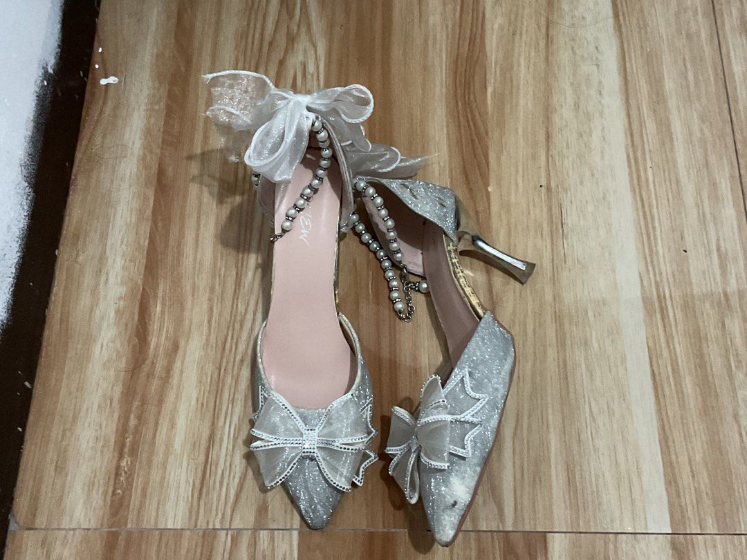 Silver Glitter Bow Heels | Size 40 (Category: Heels) located in Santa Rosa. Submitted by silvercloud_c774d5 (Listing ID 1469549827, Image 2). Description: Silver Glitter Bow Heels | Size 40 | ₱550 Selling these pretty silver glitter heels with pearl straps, rhinestone details, and cute organza bows! Perfect for parties, birthdays, graduation, or other special occasions. Price: ₱550 Size: 40 Condition: Used once only ⚠️ Flaws: Has some minor flaws