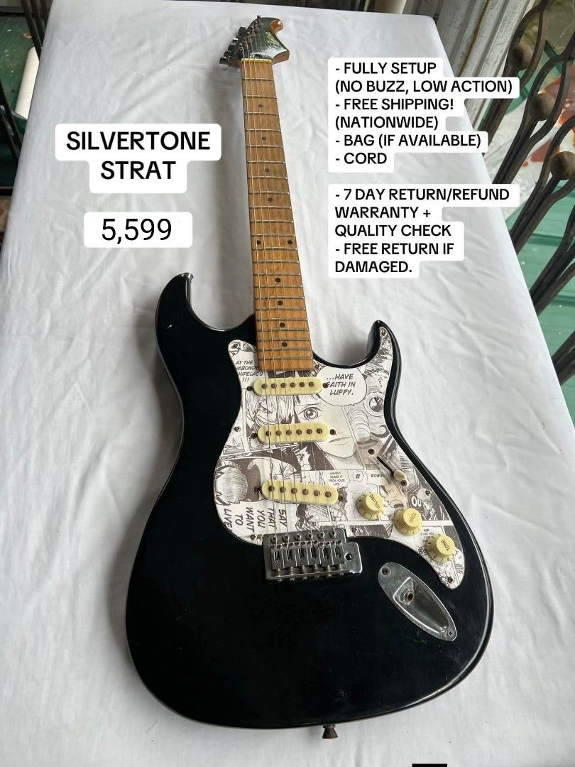 Silvertone Strat Electric Guitar with Anime Pickguard (Category: Musical Instruments) located in General Santos City (Dadiangas). Submitted by jay_roa (Listing ID 1469516516, Image 1). Description: - Silvertone Stratocaster electric guitar in a classic black finish - Eye-catching custom anime manga pickguard featuring a One Piece design - Smooth and comfortable maple neck and fretboard - Professionally setup with low action and zero fret buzz for