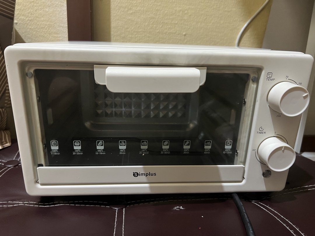 Simplus 12L Electric Oven (Category: Ovens & Toasters) located in Manila. Submitted by founduven (Listing ID 1469414510, Image 1). Description: complete with minor signs of usage fully functional.