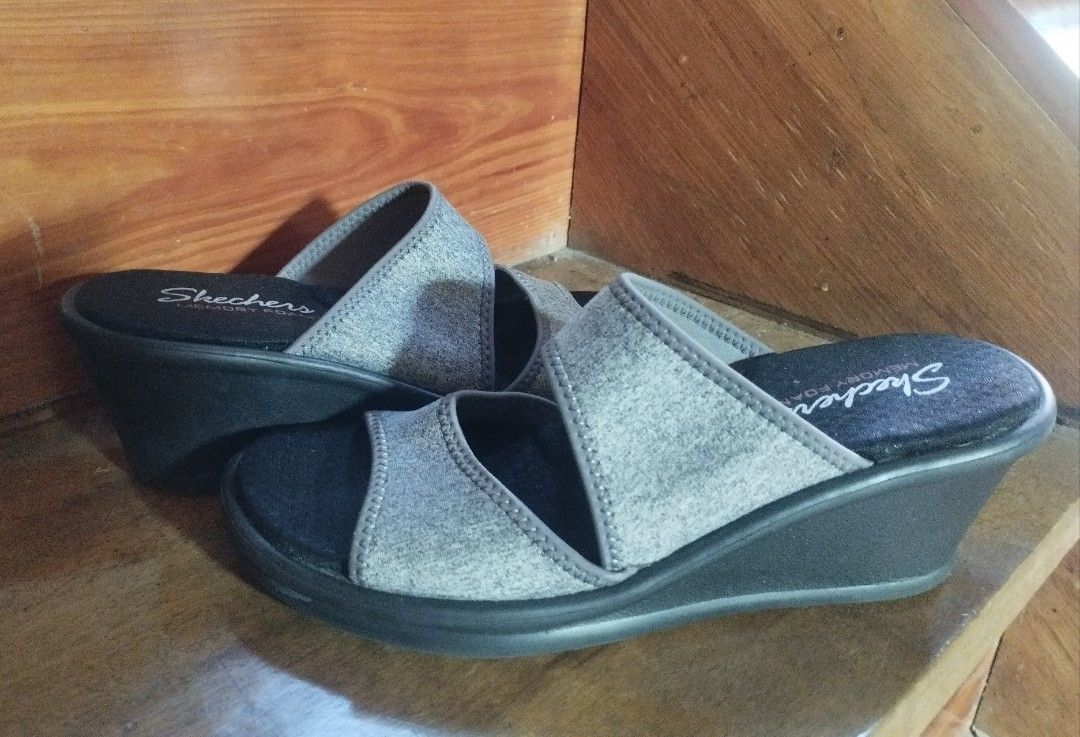 Skechers Memory Foam Wedge Sandals Gray (Category: Wedges) located in Baguio. Submitted by katgon2016 (Listing ID 1469469467, Image 2). Description: - Brand: Skechers - Style: Slip-on open toe wedge sandals with dual top straps - Color: Gray with textured black outsoles - Comfort: Features plush memory foam cushioning for all-day wear - Traction: Good grip on outsoles for safe walking - Condition: Excellent, ideal for casual outings and everyday 