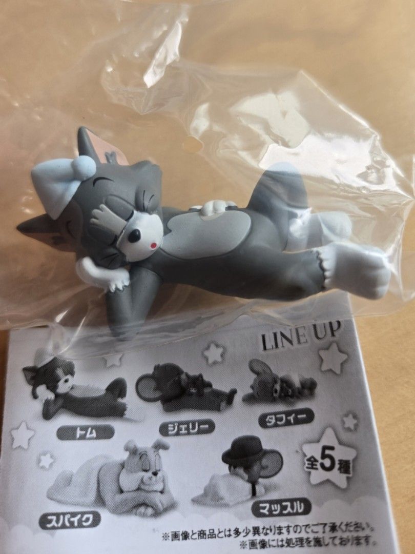 Sleeping Tom Gachapon (Category: Designer & Blind Box Toys) located in Marilao. Submitted by 4dyfaith (Listing ID 1469422618, Image 2). Description: Tom and Jerry blind box figure from the lineup series. Features sleeping Tom in grey with a cap. Brand new, unopened in original clear plastic packaging with collector leaflet. Perfect for fans and collectors!.