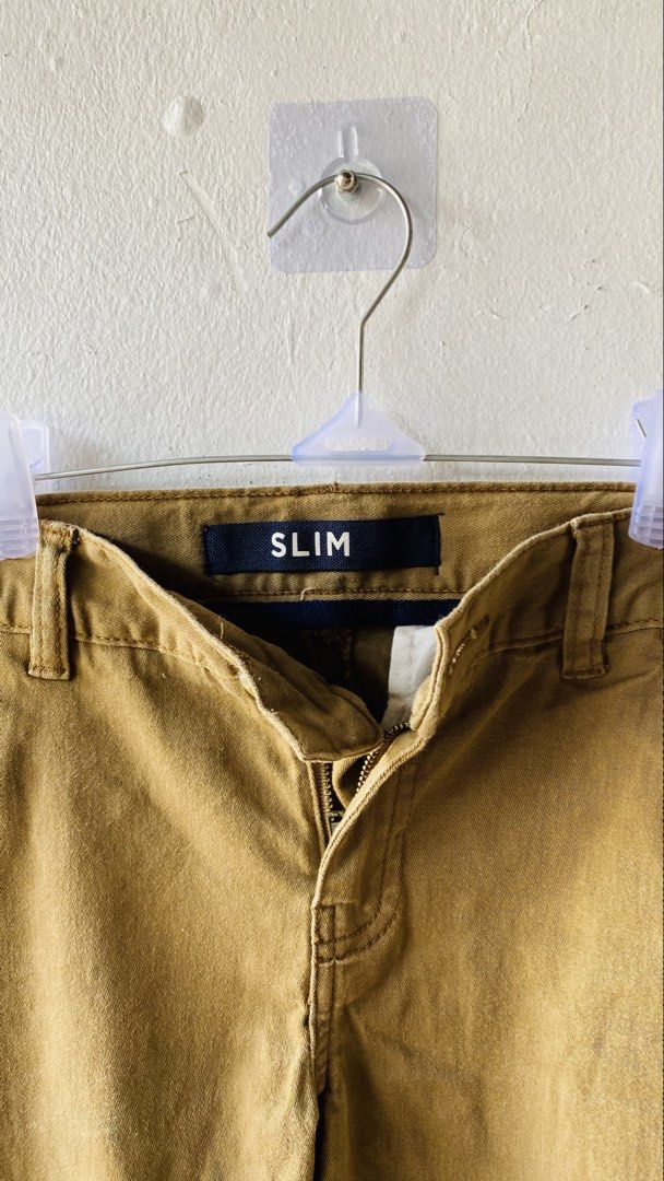 Slim Fit Khaki Pants kids (Category: Babies & Kids Fashion) located in Caloocan City. Submitted by lovemyclothes21 (Listing ID 1469416718, Image 3). Description: - Size: 6-7 years old - Fit: Modern slim fit - Color: Versatile neutral earth tone - Features: Easy zip and button closure with belt loops - Occasion: Perfect for school, parties, or everyday casual wear - Condition: Great basic essential.