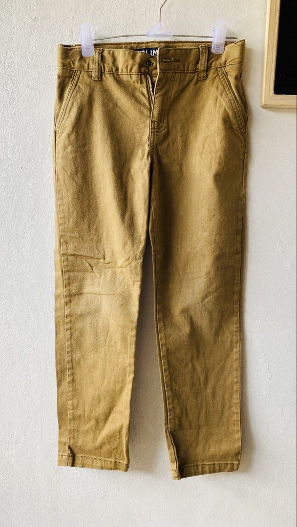 Slim Fit Khaki Pants kids (Category: Babies & Kids Fashion) located in Caloocan City. Submitted by lovemyclothes21 (Listing ID 1469416718, Image 2). Description: - Size: 6-7 years old - Fit: Modern slim fit - Color: Versatile neutral earth tone - Features: Easy zip and button closure with belt loops - Occasion: Perfect for school, parties, or everyday casual wear - Condition: Great basic essential.