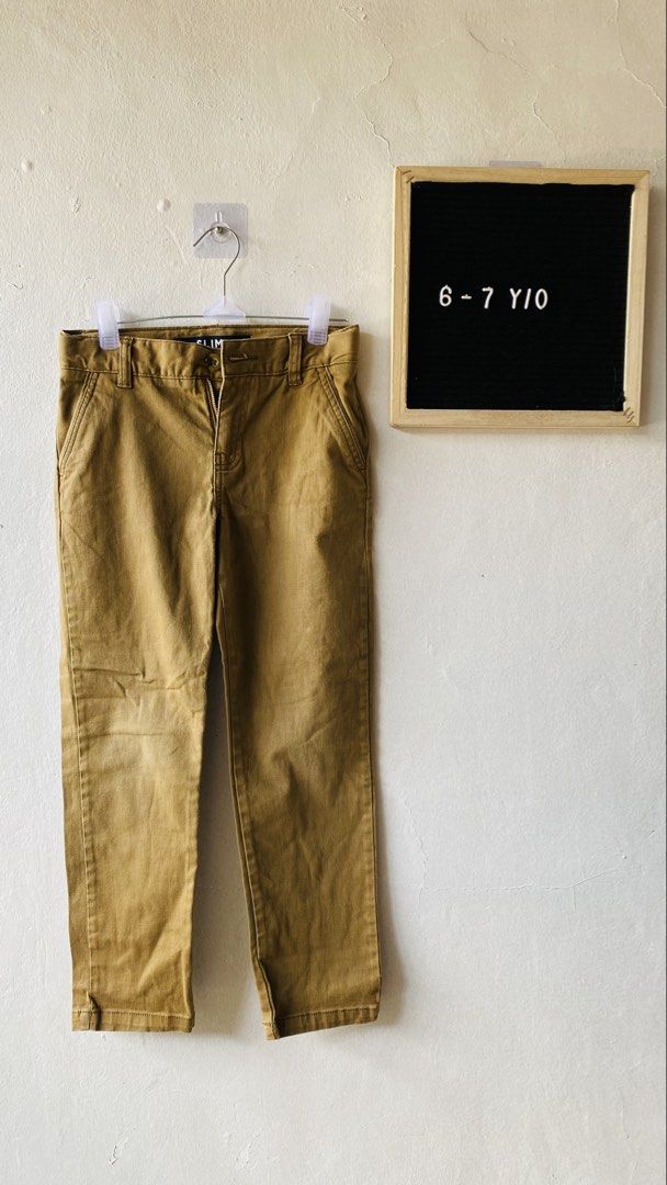 Slim Fit Khaki Pants kids (Category: Babies & Kids Fashion) located in Caloocan City. Submitted by lovemyclothes21 (Listing ID 1469416718, Image 1). Description: - Size: 6-7 years old - Fit: Modern slim fit - Color: Versatile neutral earth tone - Features: Easy zip and button closure with belt loops - Occasion: Perfect for school, parties, or everyday casual wear - Condition: Great basic essential.