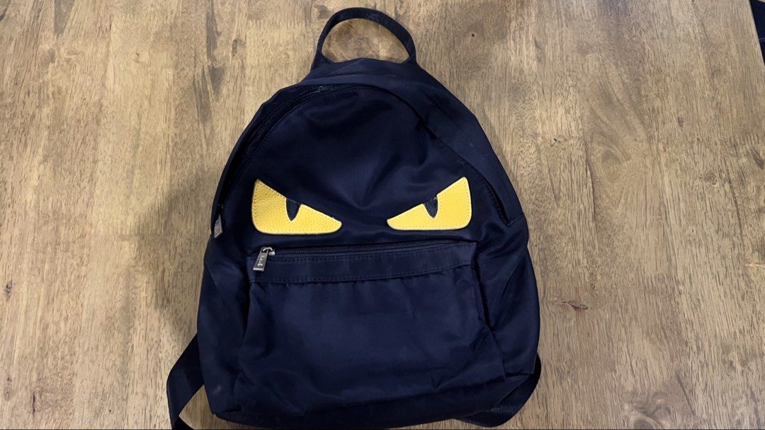 small black backpack (Category: Backpacks) located in San Fernando. Submitted by declutteringyishi (Listing ID 1469492263, Image 1). Description: there are slight stains at the bottom of the bag due to regular use, but still in a good condition..