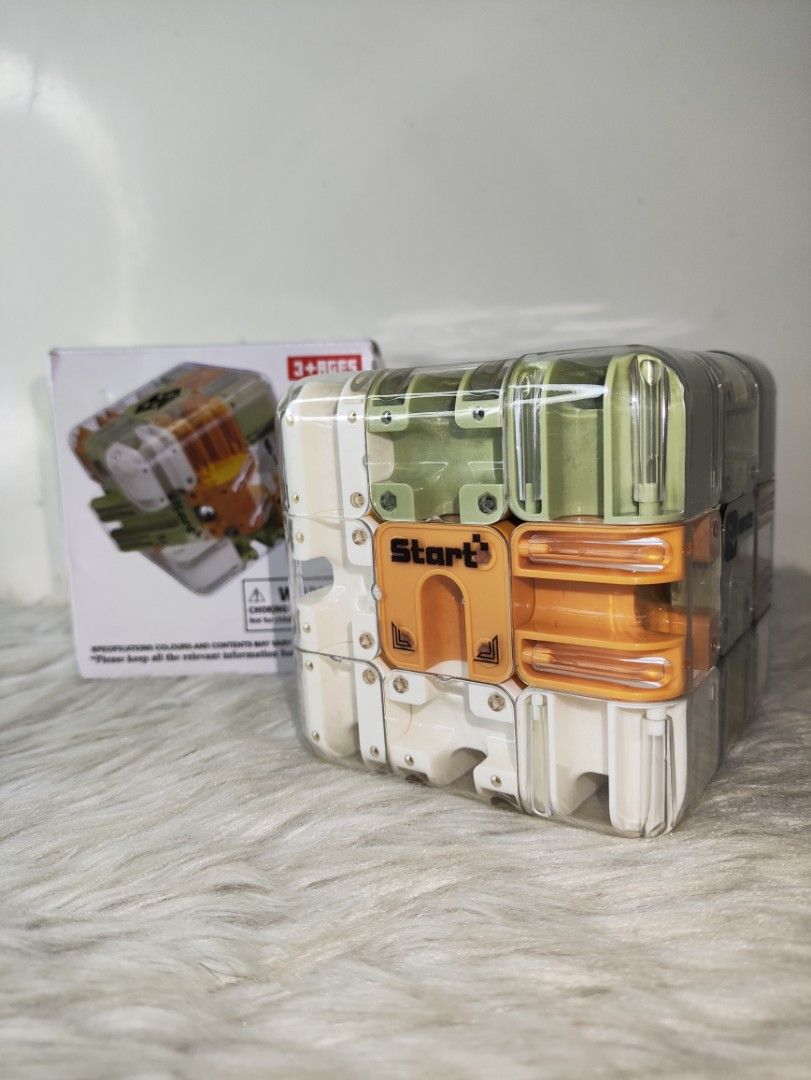 Smart Maze 3D Puzzle Cube Toy (Category: Board Games & Puzzles) located in Cavite. Submitted by tinetaclesss (Listing ID 1469498865, Image 1). Description: - Interactive smart maze puzzle cube in a sleek clear plastic housing - Features multi-colored rotating sections in white, olive green, and orange - Keeps hands busy and sharpens problem-solving skills - Suitable for kids and adults, ages 3 and up - Comes complete with its original box - great