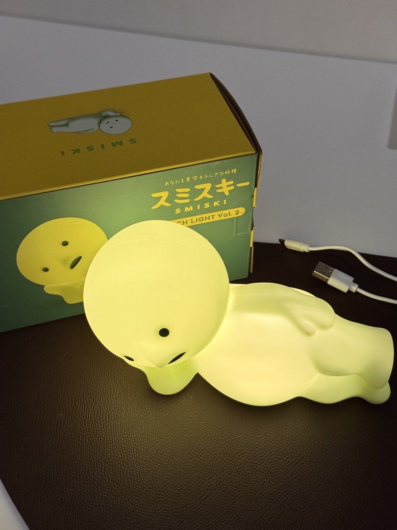 Smiski Touch Light Vol. 2 Figure Lamp with Box (Category: Designer & Blind Box Toys) located in Makati City. Submitted by from.ela (Listing ID 1469477460, Image 1). Description: - Item: Smiski Touch Light Vol. 2 (Lying Down Pose) - Condition: Like new, clean with no marks or damage - Features: Glows in the dark when lit up, tested and 100% working - Inclusions: Original box and charging cable included - Perfect for: Cute desk decor or bedside nig