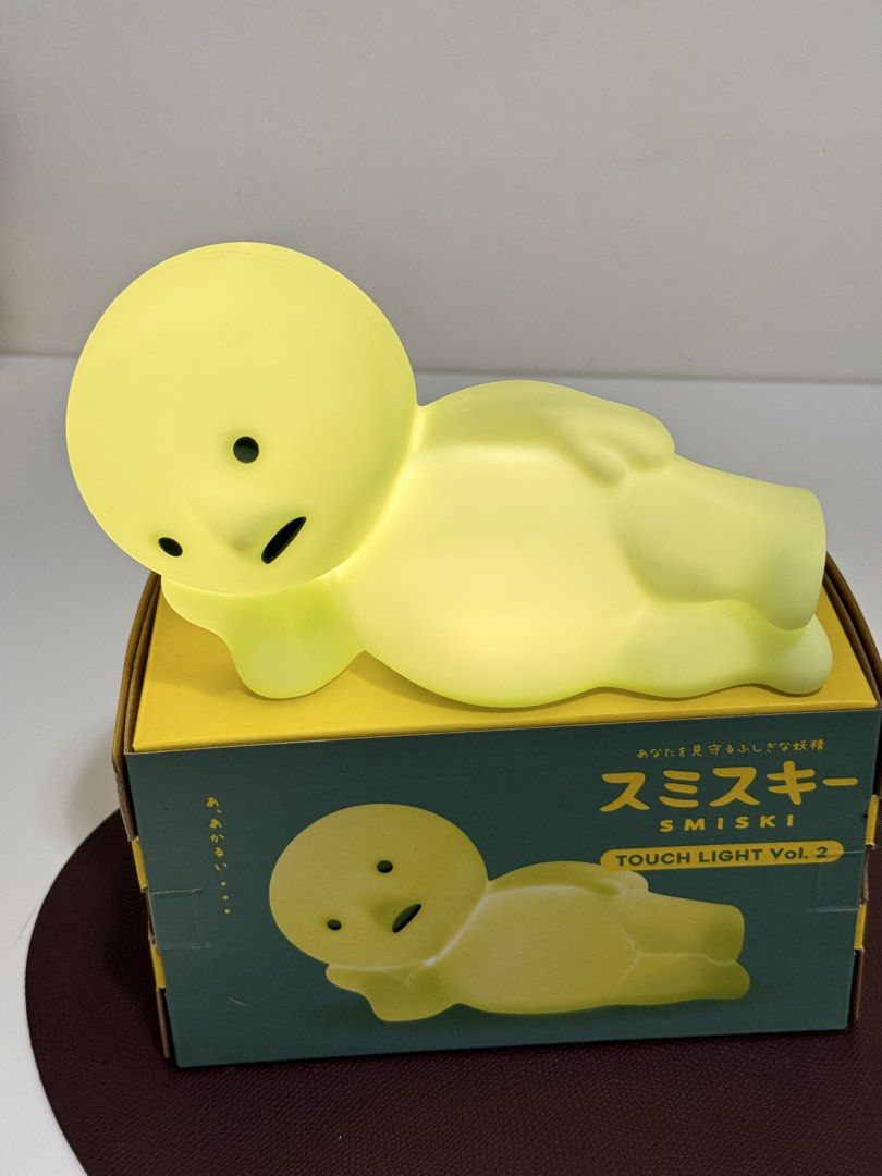 Smiski Touch Light Vol. 2 Figure Lamp with Box (Category: Designer & Blind Box Toys) located in Makati City. Submitted by from.ela (Listing ID 1469477460, Image 2). Description: - Item: Smiski Touch Light Vol. 2 (Lying Down Pose) - Condition: Like new, clean with no marks or damage - Features: Glows in the dark when lit up, tested and 100% working - Inclusions: Original box and charging cable included - Perfect for: Cute desk decor or bedside nig