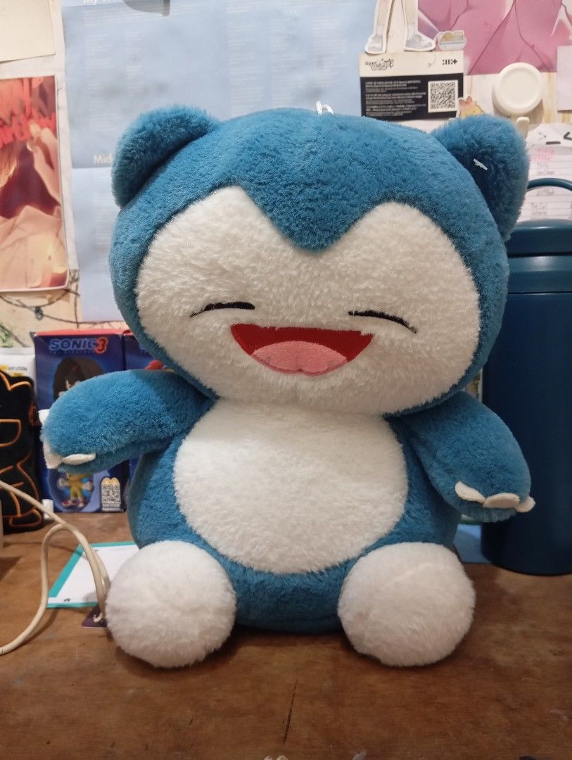 Snorlax Pokemon Plushie (Category: Plushies & Soft Toys) located in Cebu City. Submitted by nayuyuun (Listing ID 1469457951, Image 1). Description: ‼️PLEASE READ THE ENTIRE DESCRIPTION ‼️ 🐾 | ABOUT THE PLUSHIE: • Fluffy and huggable! Perfect as a gift for snorlax lovers! (⁠ ⁠◜⁠‿⁠◝⁠ ⁠)⁠♡ • His size is similar to miniso plushies like the small penguin! (Kindly send a message for inquiries!) • Has only been kept as a display on my desk because he's