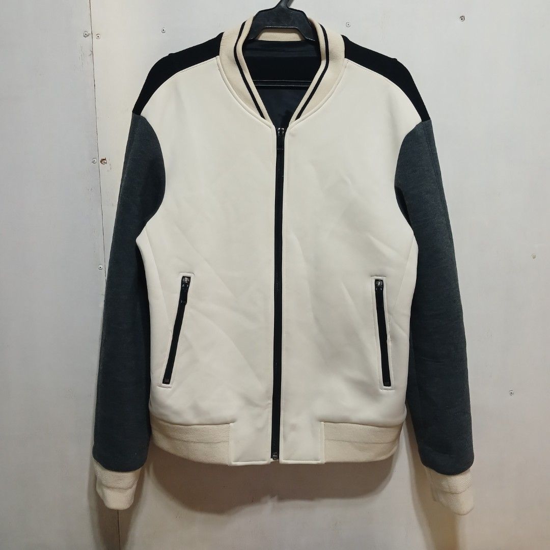 Solid Homme Bomber Jacket Size 48 (Category: Coats, Jackets and Outerwear) located in Manila. Submitted by joefrey12 (Listing ID 1469495117, Image 1). Description: - Brand: Solid Homme - Style: Colorblock bomber jacket (White, Black, Dark Grey) - Size: 48 (Made in Korea) 21x27 - Features: Zip closure, two side zipper pockets, ribbed collar, cuffs, and hem - Material: Wool blend (Note: fabric is prone to pilling as per care label) - Condition: Exc