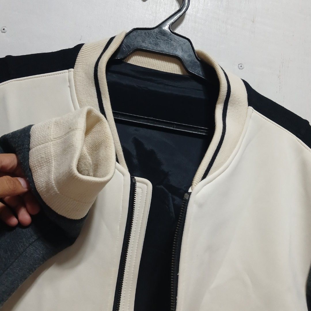 Solid Homme Bomber Jacket Size 48 (Category: Coats, Jackets and Outerwear) located in Manila. Submitted by joefrey12 (Listing ID 1469495117, Image 2). Description: - Brand: Solid Homme - Style: Colorblock bomber jacket (White, Black, Dark Grey) - Size: 48 (Made in Korea) 21x27 - Features: Zip closure, two side zipper pockets, ribbed collar, cuffs, and hem - Material: Wool blend (Note: fabric is prone to pilling as per care label) - Condition: Exc