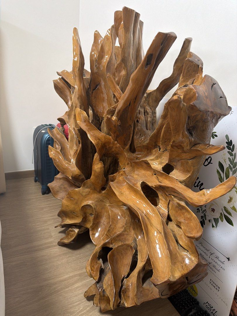 Solid Teak Root Table Base (Category: Other Home Furniture) located in Singapore. Submitted by rinokatak101042 (Listing ID 1469439005, Image 2). Description: - Material: Solid natural wood with a polished finish - Design: Organic piece featuring intricate branches, knots, and rich brown wood grain tones - Use: Ideal standalone accent piece for your home or office - Beautiful: Solid teak root table base. Strong and unique natural wood design. - No