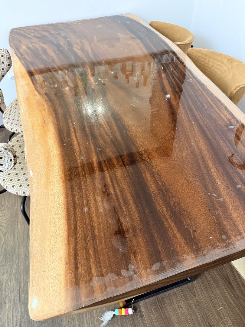 Solid wood table (Category: Tables & Sets) located in Singapore. Submitted by zhaoyuehrb (Listing ID 1469467969, Image 2). Description: One-piece solid wood table with metal frame. 180 x 90 cm. Protected under acrylic cover. Table is in like new condition. Very very heavy, please self-arrange pickup near Bukit Batok. Table is $200 fixed price. 4 chairs at $20 each. Bundle price $250. .
