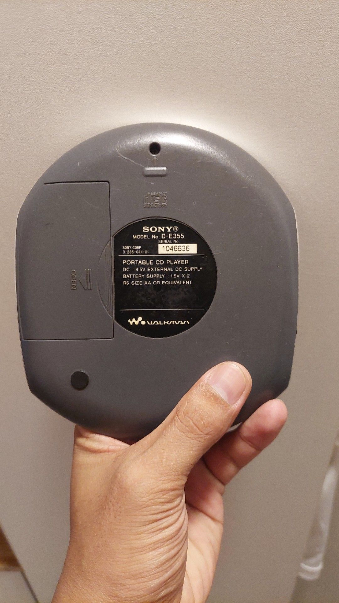 Sony Walkman Portable CD Player D-E355 (Category: Portable Music Players) located in Manila. Submitted by lesterjohn17980 (Listing ID 1469561572, Image 2). Description: working condition po and vintage walkman year 2000, may mga dents at scratch pero common naman since second hand and sobrang tagal na po neto. Sony Walkman portable CD player, model D-E355. Silver finish with a purple window on the lid and a sticker on top. Digital LCD screen on t
