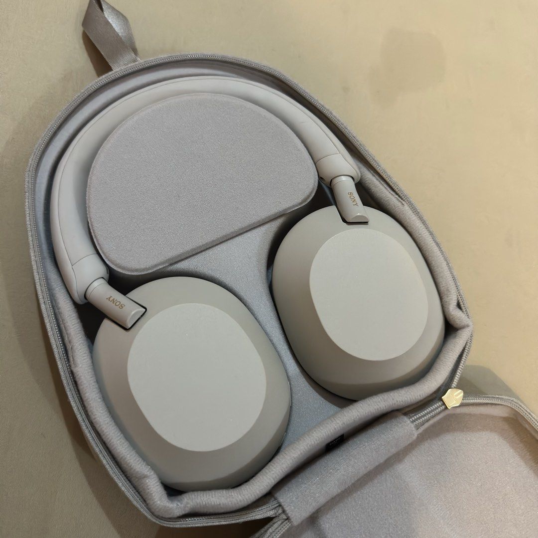 Sony WH-1000XM5 (Category: Headphones & Headsets) located in Muntinlupa City. Submitted by xhoshix (Listing ID 1469541024, Image 1). Description: - Model: Sony xm5 headphones - Color: Silver grey - Condition: Clean earcups and headband padding - Original zippered hard case - Original Audio cable - Original Charger cord Price is negotiable .