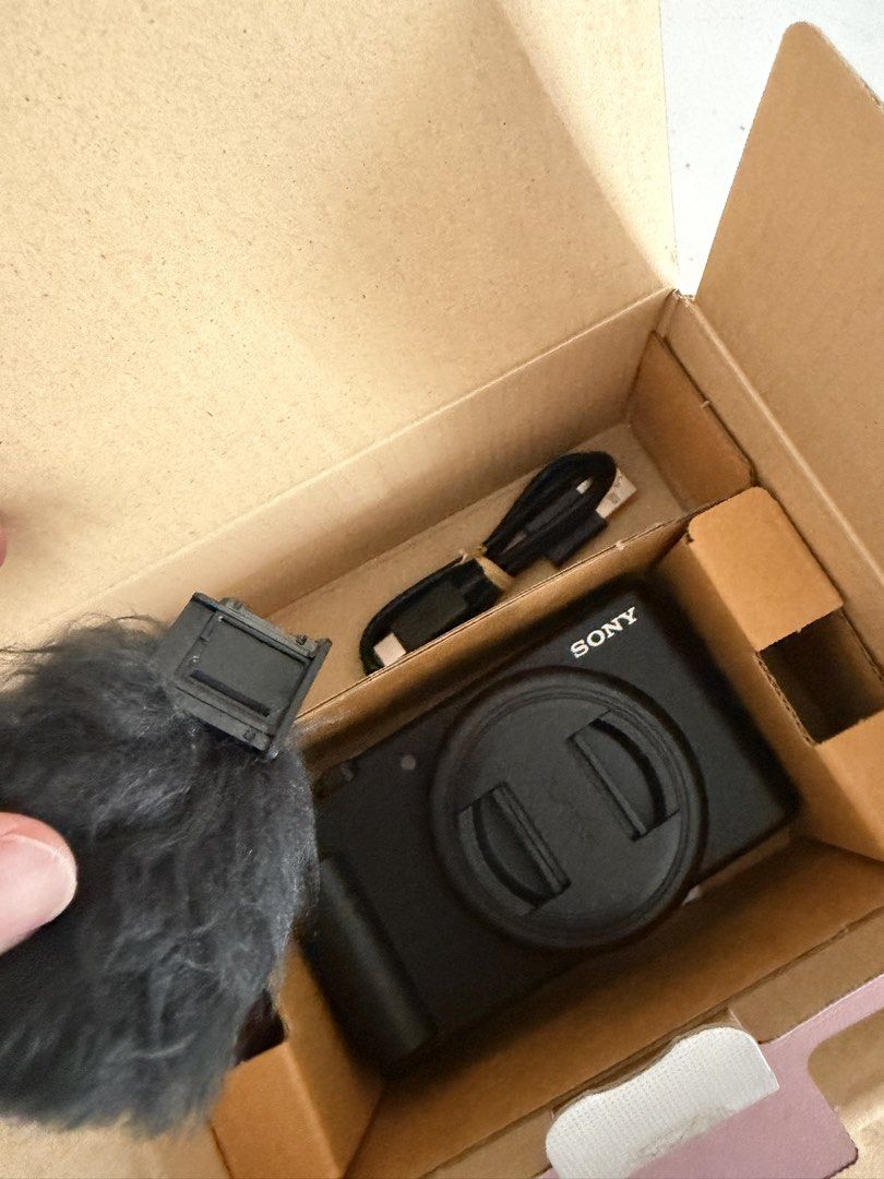 Sony ZV-1F Digital Camera (Category: Cameras) located in Antipolo. Submitted by sugarpop.mnl (Listing ID 1469498125, Image 2). Description: - Model: Sony ZV-1F Digital Camera - Color: Black - Condition: Excellent, complete with original box, barely used - Included accessories: USB-C cable, wind screen, and instruction manuals - Key features: Compact setup, flip-out screen, and simple controls - Ideal for: Daily shooting.