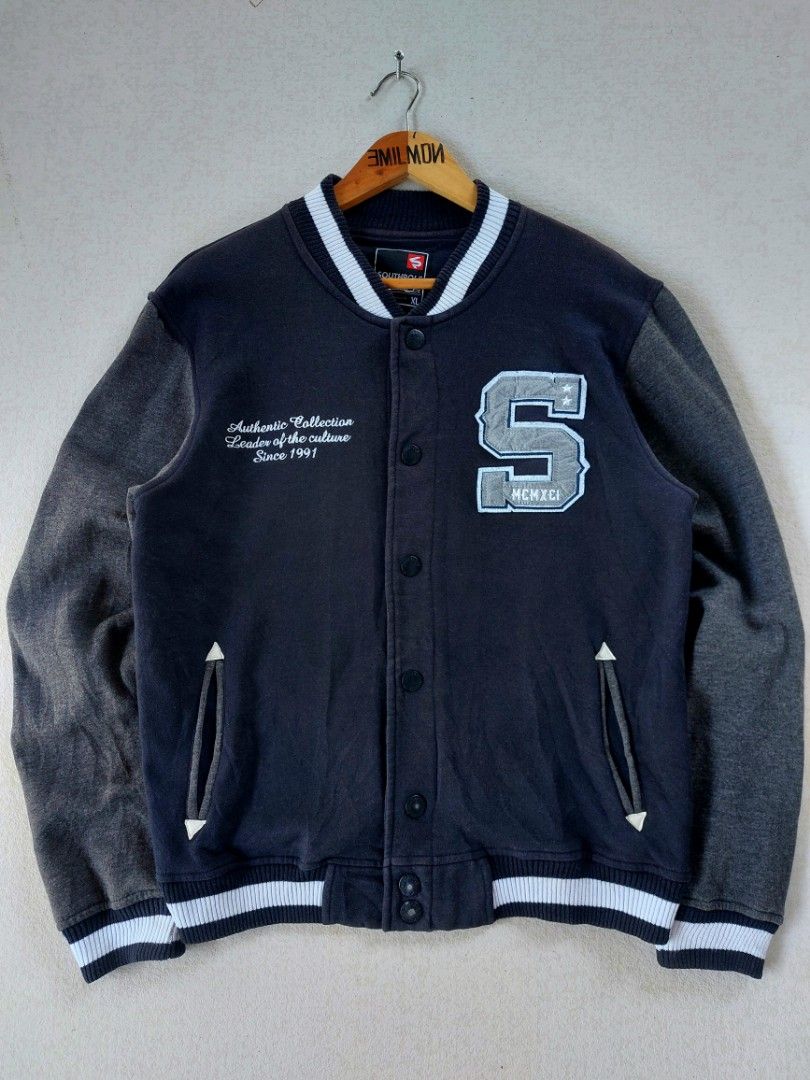 Southpole 2000's Varsity Fleece Jacket (Category: Coats, Jackets and Outerwear) located in Palayan City. Submitted by akhai420 (Listing ID 1469423972, Image 1). Description: - Brand: Southpole - Style: Varsity jacket - Color: Black and dark grey - Size: XL on tag / best fit Large - Details: Large 'S' chest patch with stars and MCMXCI text - Embroidery: 'Authentic Collection Leader of the culture Since 1991' - Features: Button-up front, slip pocke
