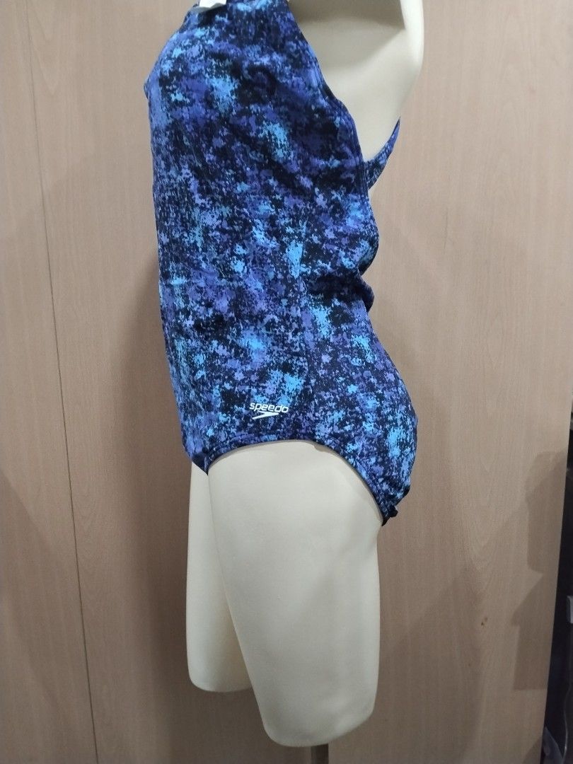 Speedo Blue Patterned One-Piece Swimsuit Size 18 (Category: Bikinis & Swimsuits) located in Manila. Submitted by ajrswimwear (Listing ID 1469556124, Image 2). Description: - Brand: Speedo - Style: One-piece swimsuit with chic criss-cross strap back - Pattern: Blue and black abstract - Size: 18 (tag attached inside) - Material: 80% nylon, 20% spandex (shell); 100% polyester (lining) - Condition: Brand new with tags.