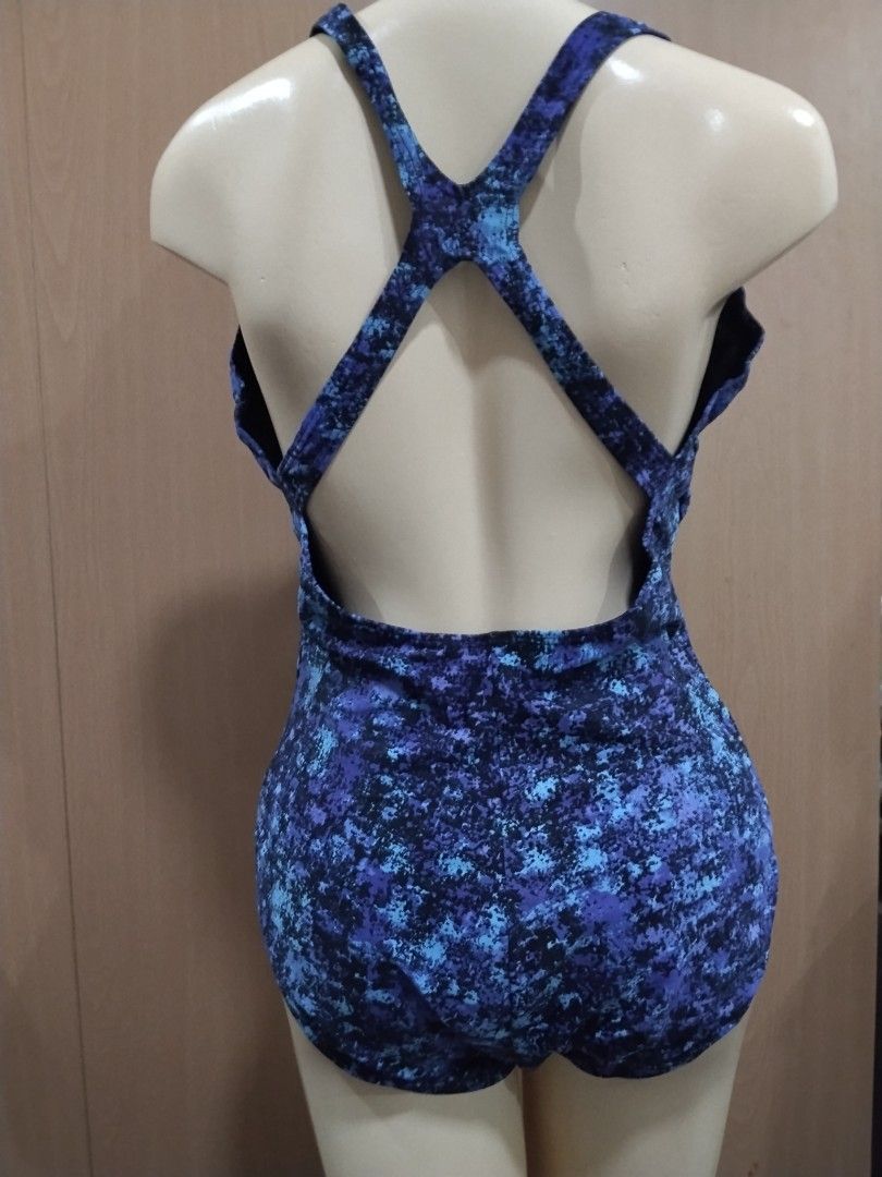 Speedo Blue Patterned One-Piece Swimsuit Size 18 (Category: Bikinis & Swimsuits) located in Manila. Submitted by ajrswimwear (Listing ID 1469556124, Image 3). Description: - Brand: Speedo - Style: One-piece swimsuit with chic criss-cross strap back - Pattern: Blue and black abstract - Size: 18 (tag attached inside) - Material: 80% nylon, 20% spandex (shell); 100% polyester (lining) - Condition: Brand new with tags.