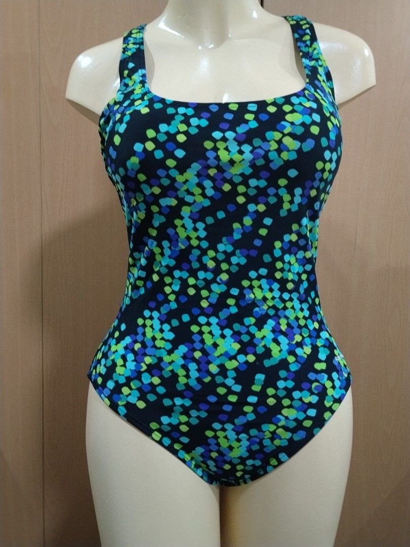 Speedo One-Piece Swimsuit Size 10 (Category: Bikinis & Swimsuits) located in Manila. Submitted by ajrswimwear (Listing ID 1469556244, Image 1). Description: - Brand: Speedo - Style: One-piece swimsuit with scoop neckline and cross-back straps - Size: 10 - Material: Nylon and spandex for a comfortable, stretchy fit - Design: Black base with a colourful mosaic dot pattern in blue, green, and purple, plus white Speedo logo near the hip - Condition: 