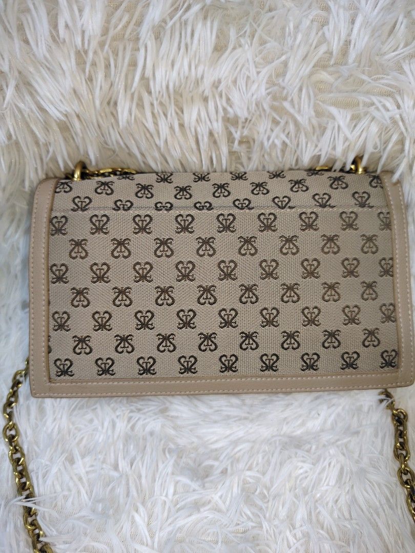 Staccato Monogram Pattern Wallet (Category: Cross-body Bags) located in Quezon City. Submitted by zhelcloset01 (Listing ID 1469320318, Image 2). Description: - Brand: Staccato - Design: All-over monogram pattern on beige fabric - Hardware: Gold-tone Staccato brand name plate - Size: Compact and pocket-friendly - Condition: Clean canvas with neat stitching.