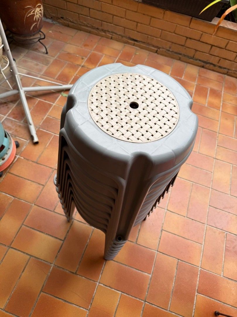 Stackable Grey Plastic Stools Set (Category: Chairs) located in Singapore. Submitted by kntnn (Listing ID 1469396873, Image 3). Description: Bundle of stackable grey plastic stools with textured anti-slip tops and sturdy legs. Perfect for extra seating indoors, on the balcony, or at outdoor gatherings.8 for 40 dollars. .