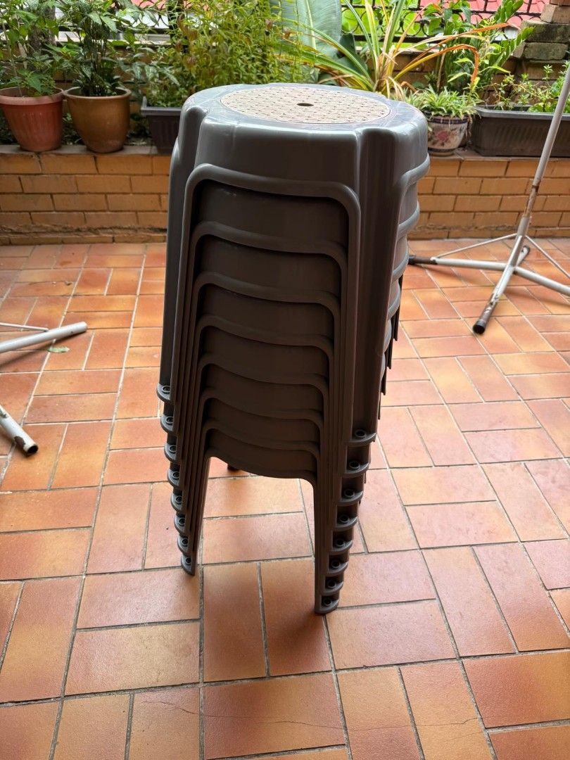 Stackable Grey Plastic Stools Set (Category: Chairs) located in Singapore. Submitted by kntnn (Listing ID 1469396873, Image 2). Description: Bundle of stackable grey plastic stools with textured anti-slip tops and sturdy legs. Perfect for extra seating indoors, on the balcony, or at outdoor gatherings.8 for 40 dollars. .