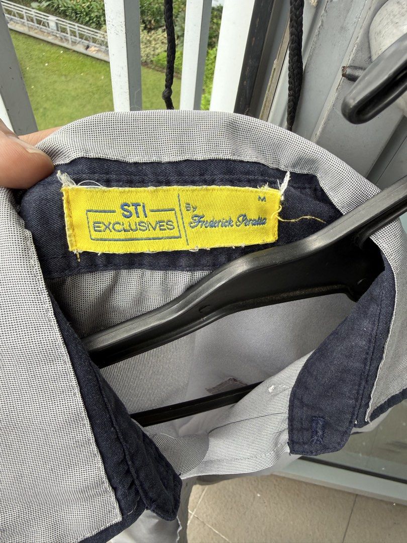 STI BS IT uniform Medium (all 3pcs) (Category: Tshirts & Polo Shirts ) located in Famy. Submitted by echolima21 (Listing ID 1469432381, Image 2). Description: - Brand/Designer: STI Exclusives by Frederick Peralta - Color: Gray with contrasting dark blue collar, pocket trim, and cuffs - Size: Medium - Features: Button-up front, roll-up sleeves with button tabs - Condition: Pre-loved with flaws (a couple of small holes near the bottom hem and a sma