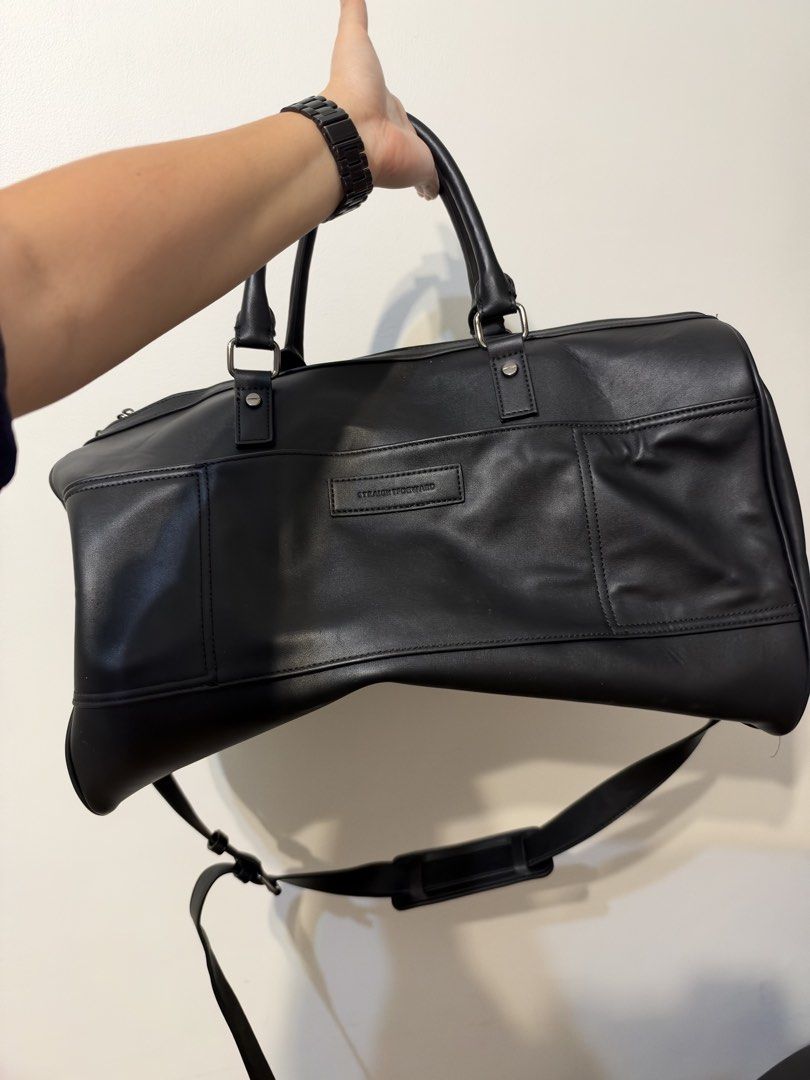 Straightforward Black Leather Travel Duffel Bag (Category: Sling Bags) located in Manila. Submitted by garagesalebykoda (Listing ID 1469511857, Image 1). Description: - Brand: Straightforward - Color: Classic Black - Material: Durable synthetic leather - Carry options: Dual top handles and adjustable shoulder strap - Design: Stylish front buckle details - Storage: Large main compartment with a secure zippered inner pocket - Condition: Clean inter