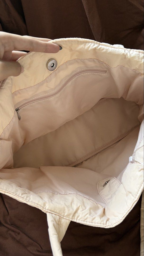 Straightforward Kulcha tote (Category: Tote Bags) located in Taguig. Submitted by awatc_hes (Listing ID 1469445072, Image 3). Description: - Color: soft Biscuit - Material: Soft quilted fabric with diamond stitching - Closure: Magnetic snap top - Storage: 1 zippered inner pocket and 1 slip pocket - Structure: Flat base (stands on its own) - Straps: Double shoulder straps - Capacity: Spacious enough for laptops, books, and daily essentials - Condi