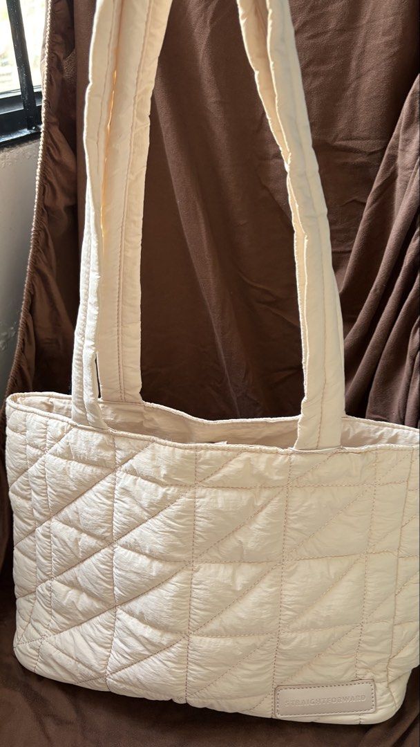 Straightforward Kulcha tote (Category: Tote Bags) located in Taguig. Submitted by awatc_hes (Listing ID 1469445072, Image 1). Description: - Color: soft Biscuit - Material: Soft quilted fabric with diamond stitching - Closure: Magnetic snap top - Storage: 1 zippered inner pocket and 1 slip pocket - Structure: Flat base (stands on its own) - Straps: Double shoulder straps - Capacity: Spacious enough for laptops, books, and daily essentials - Condi