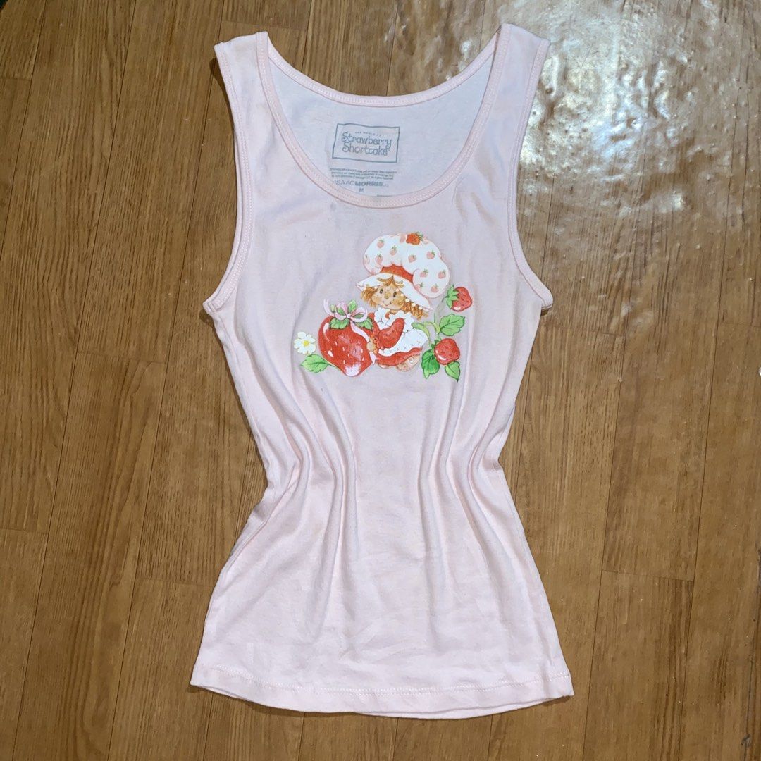 Strawberry Shortcake sando (Category: Sleeveless) located in General Trias. Submitted by swagster.archives (Listing ID 1469534710, Image 1). Description: Strawberry Shortcake top W- 12 inches L- 23.5 inches Flaw; Washable stain Need wash ₱250.