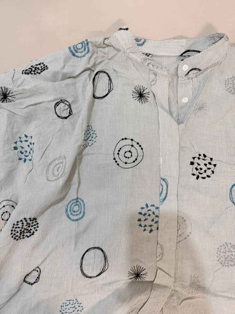Striped Short Sleeve Blouse with Abstract Pattern (Category: Blouses) located in Paranaque City. Submitted by hannahking36 (Listing ID 1469539394, Image 3). Description: - Color/Pattern: White and blue stripes with fun abstract circles and geometric prints - Style: Short sleeves, collar, and button-up front - Fit: Relaxed and lightweight for ultimate comfort - Versatility: Easy to style with casual jeans or shorts - Mode of Payment: GCash or BPI 
