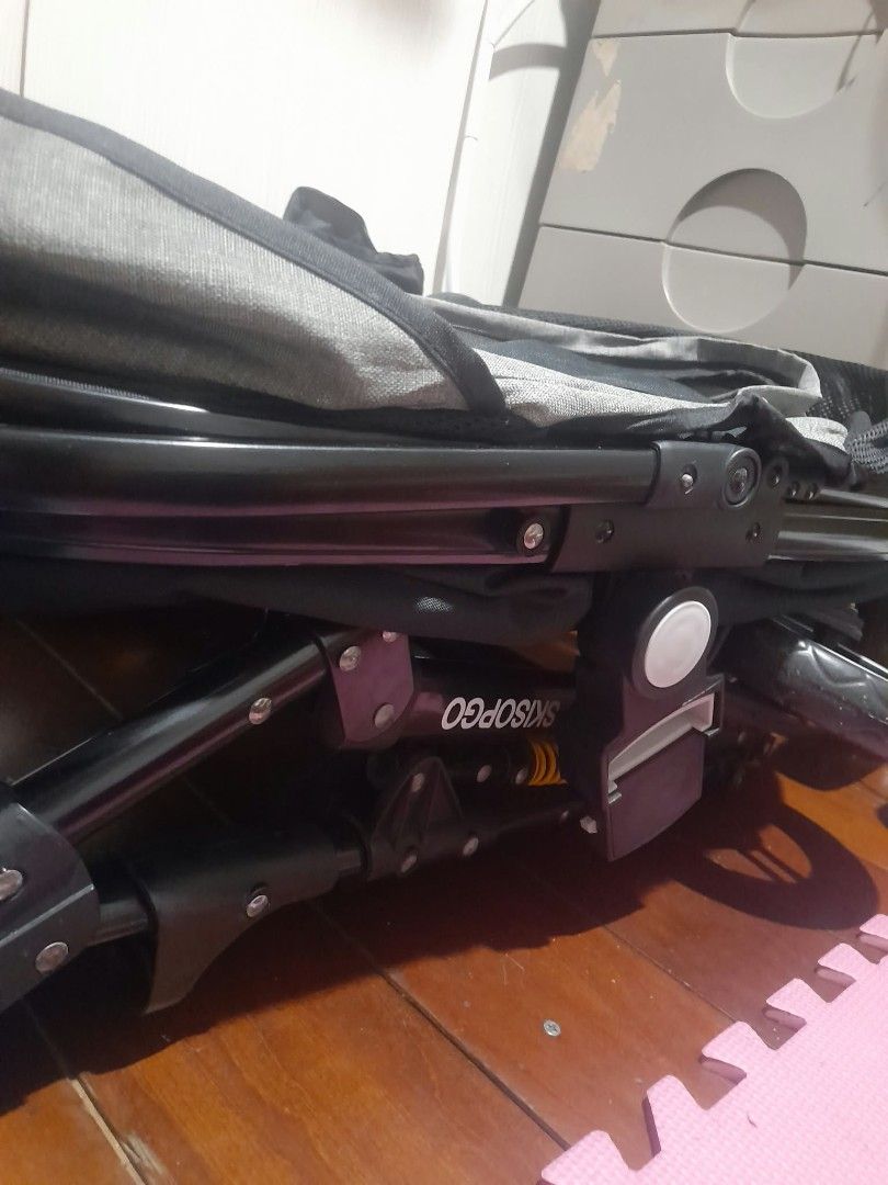 Stroller for pet (Category: Baby Monitors) located in Manila. Submitted by brightstar.b55721 (Listing ID 1469414163, Image 2). Description: Product Description * Item Type: Pet Stroller (Brand: SKISOPGO). * Color: Black frame and main fabric body, with dark grey inner lining along the carrier canopy. * Carrier Compartment: * Features a spacious enclosed fabric carrier compartment with an open canopy top for easy access and ventilation. * Sturdy b
