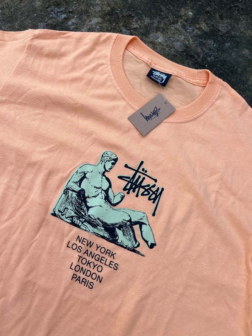 Stussy Dionysos Tee Peach Size M (Category: Tshirts & Polo Shirts ) located in Bacolod City. Submitted by rimboythrift (Listing ID 1469428427, Image 2). Description: - Brand new with original store tags attached - Color: Peach - Classic Stussy Dionysos statue graphic with global cities (New York, Los Angeles, Tokyo, London, Paris) - Material: 100% premium cotton - Fit: Short sleeves, crew neck - Origin: Made in Mexico - Authentic streetwear ready