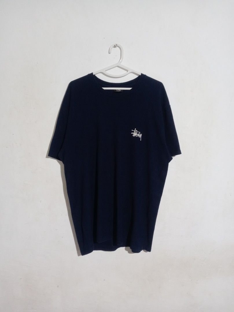 Stussy Navy Blue Logo Tee Size L (Category: Tshirts & Polo Shirts ) located in Nagcarlan. Submitted by asd0606 (Listing ID 1469503467, Image 1). Description: - Brand: Stussy - Color: Dark Navy Blue - Size: Large (tag inside collar) - Origin: Made in Mexico - Design: Small left-chest print with a large back graphic - Fit: Standard crew neck, short sleeves - Condition: Clean cotton fabric, solid everyday streetwear staple 799+sf Authenticity not gu
