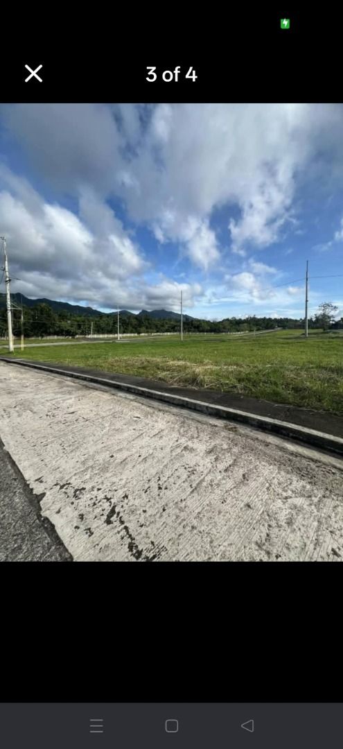 Summit Point Phase 3E (Category: Lot) located in Marikina City. Submitted by noelleg88 (Listing ID 1469455046, Image 2). Description: - Location: Phase 3E, Summit Point Brookside - Property Type: Vacant residential lot, ready for construction or investment - Views: Clear skies, surrounding greenery, and distant mountains - Accessibility: Paved concrete road directly in front of the property - Security: Located inside a secure, gated community - I